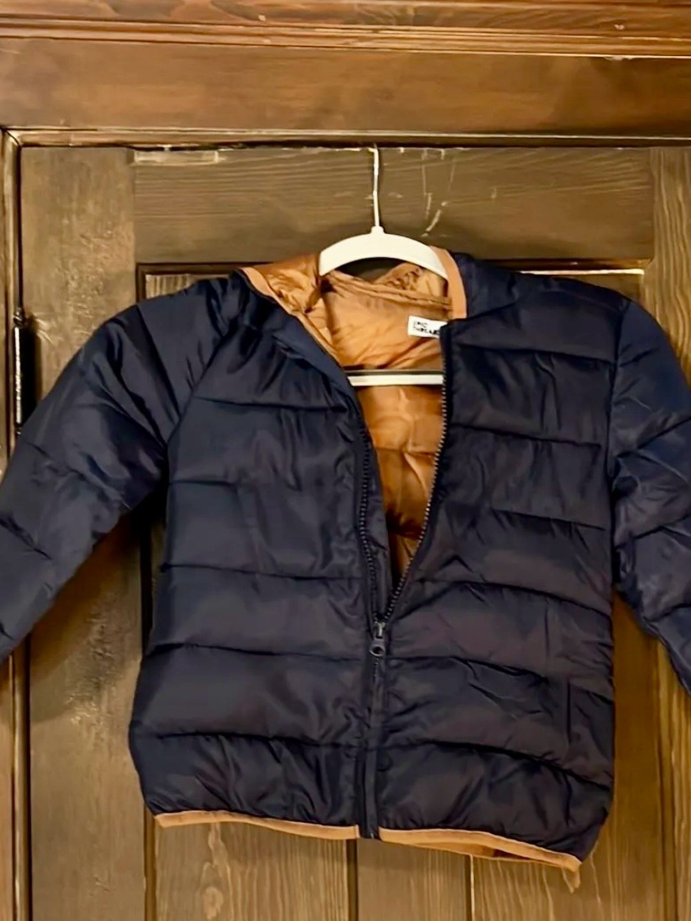 Epic Threads Puffer Jacket in Navy and Tan packs in a cute bear bag